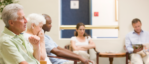 Image of patients in a waiting room at a general practice