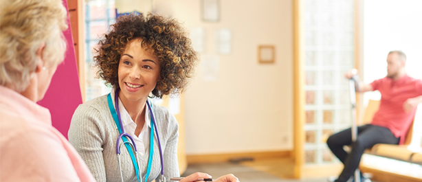 Image of doctor in waiting room with patient at general practice