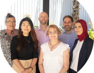 Header image of a diverse AGPAL team of staff smiling at the camera