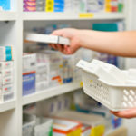 Pharmacist filling prescription in pharmacy store Pharmacist filling prescription in pharmacy drugstore