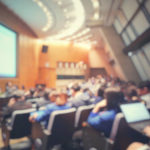 Blur of auditorium room use for present meeting background