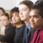 Young business people including an Australian aboriginal woman