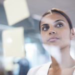 Australian aboriginal woman thinking ideas in the office.